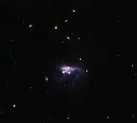 ARP 263 centrata su NGC 3239 Collisione Galattica e distorsione nel Leone